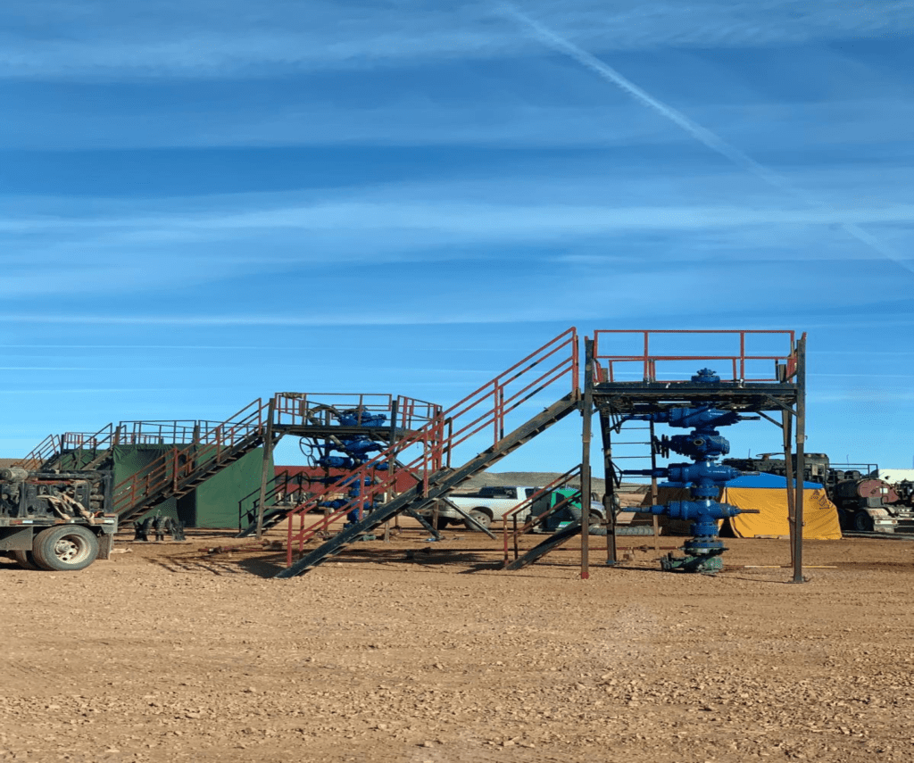 A field with stairs and a blue sky