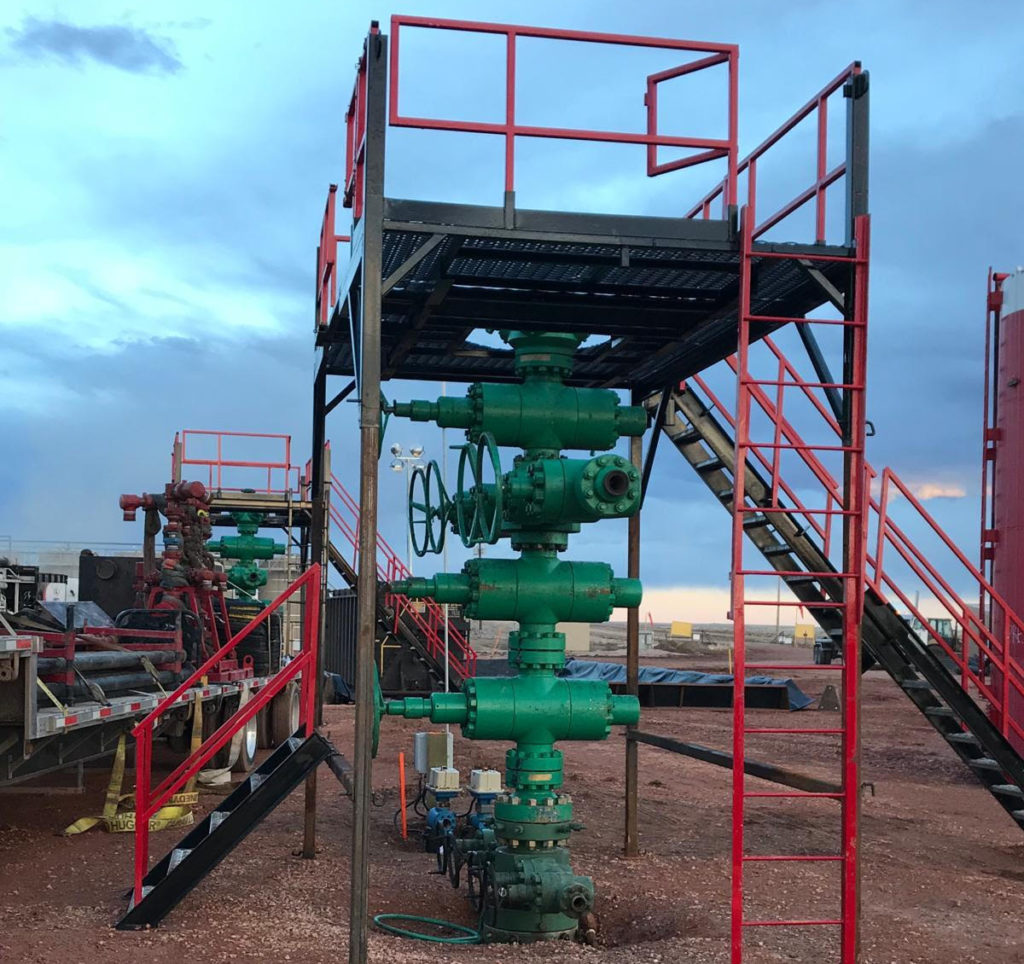 A green and red pipe system with stairs