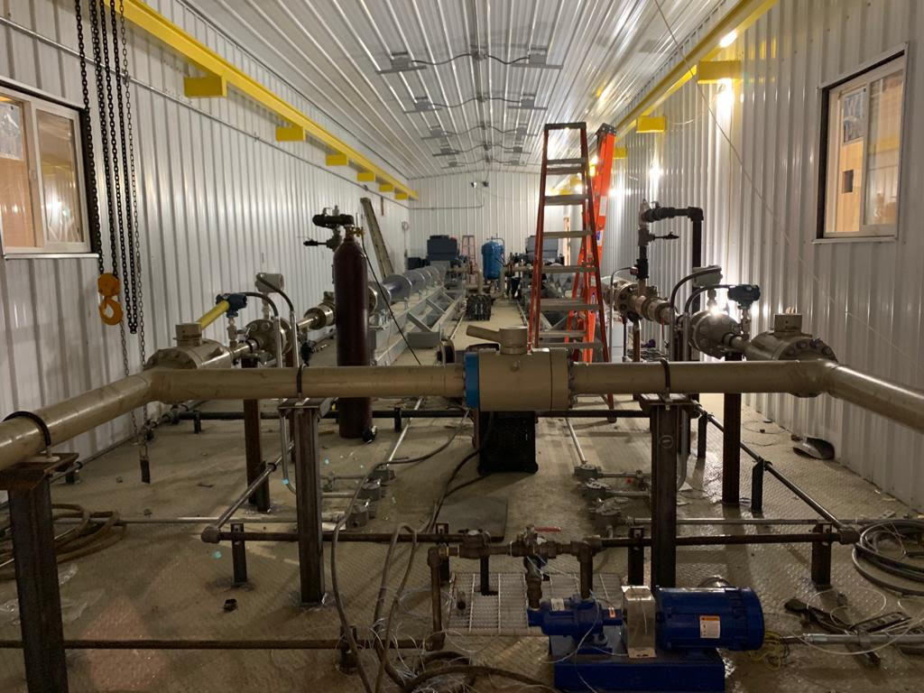 A large room with pipes and equipment in it.