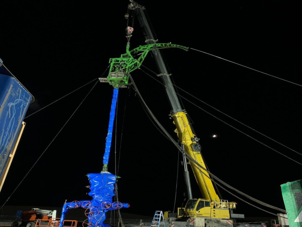 A crane is being lifted by a crane.