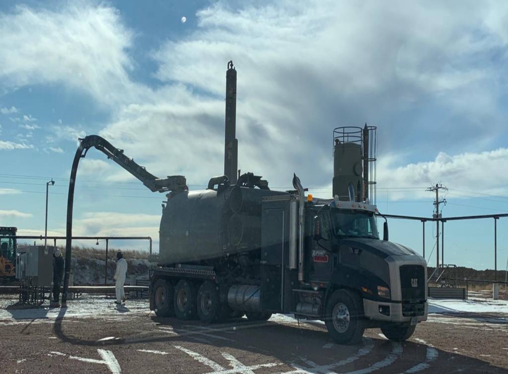 A large truck is parked on the side of the road.