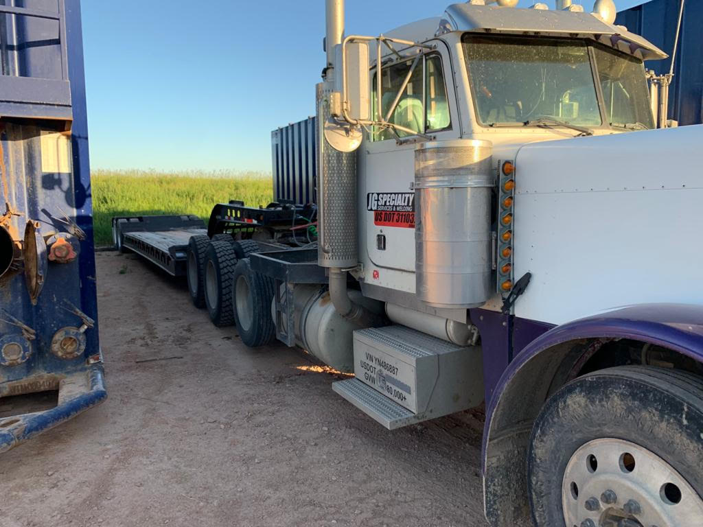 A large truck is parked on the side of the road.