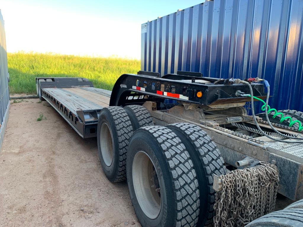 A large truck with tires on the road.