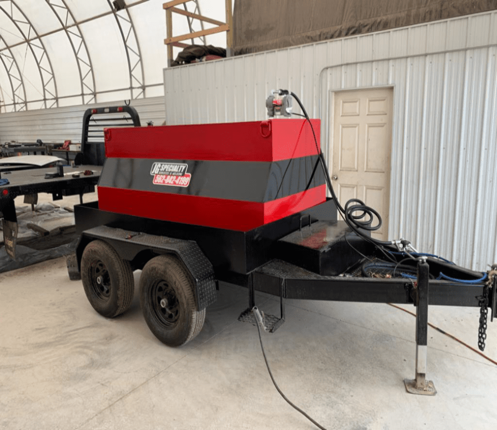 A red and black trailer with a generator on it.